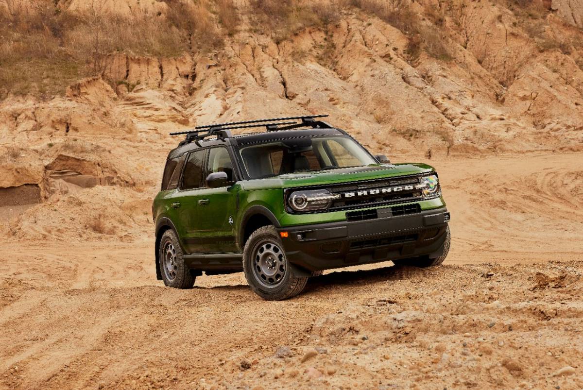 A green 2023 Ford Bronco Sport on display while off-roading.