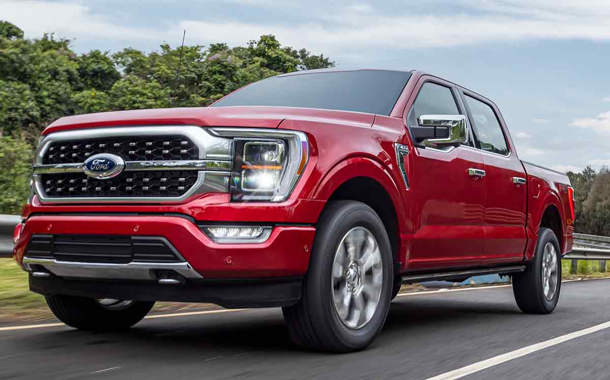 A bright red 2023 Ford F-150 on the road