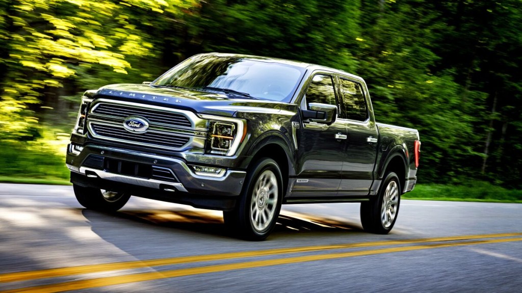 The 2023 Ford F-150 driving on a country road 