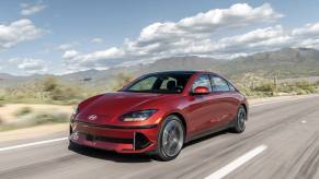 The 2023 Hyundai Ioniq 6 driving down a road in the desert