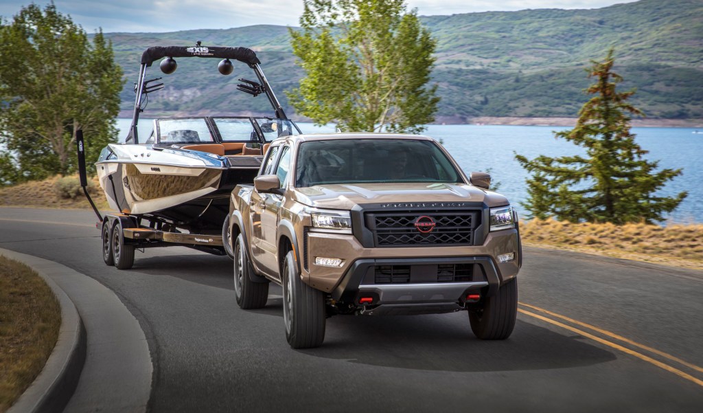 The 2023 Nissan Frontier towing a boat