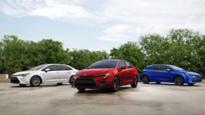 (L to R) white, red, and blue Toyota Corolla compact car family models