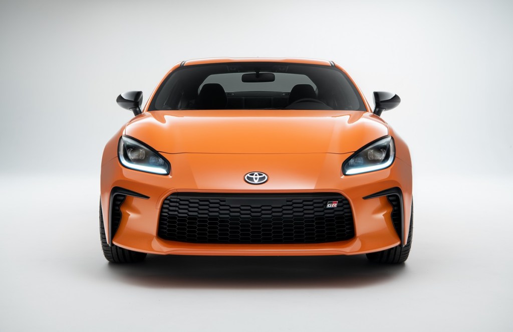 An orange 2023 Toyota GR86 shows off its non-hybrid platform and fascia.