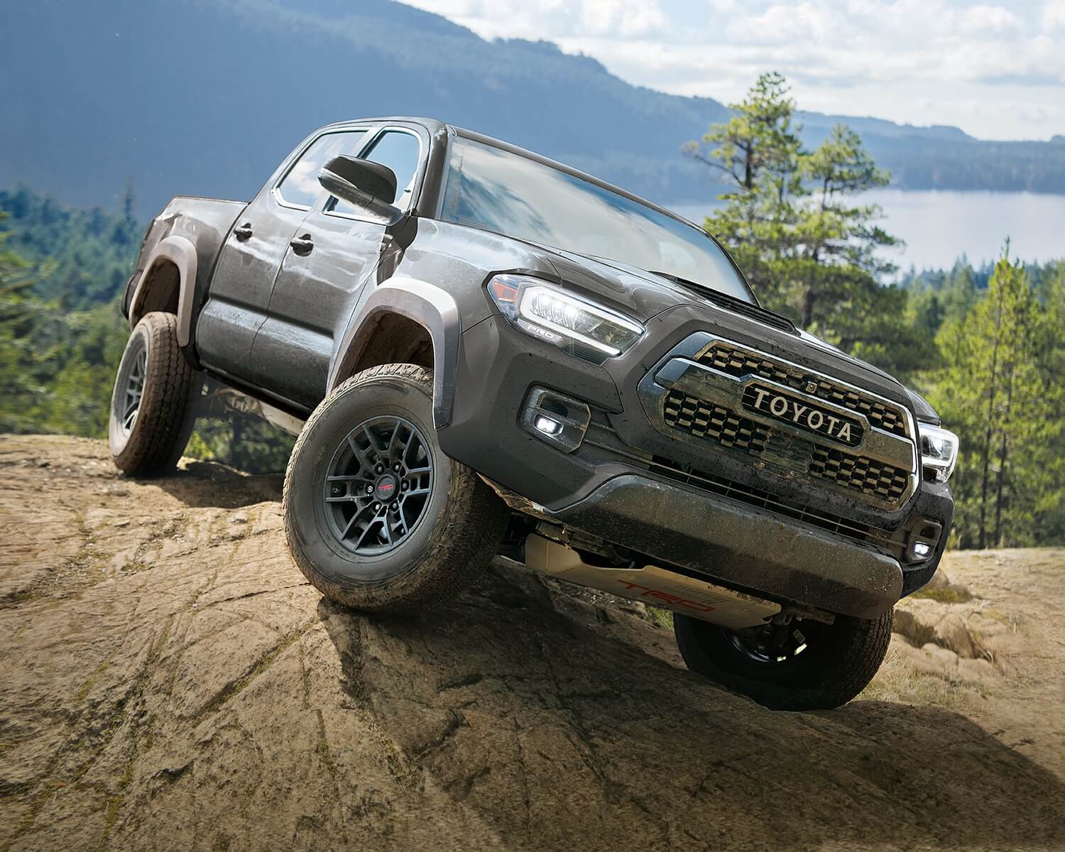 The 2023 Toyota Tacoma off-roading and climbing over rocks
