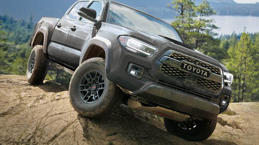The 2023 Toyota Tacoma off-roading and climbing over rocks