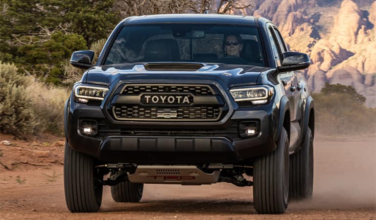 The 2023 Toyota Tacoma off-roading in the dirt 