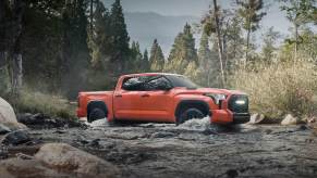 The 2023 Toyota Tundra TRD Pro off-roading in a stream