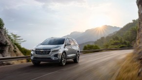A 2023 Chevrolet Equinox driving down a winding road.