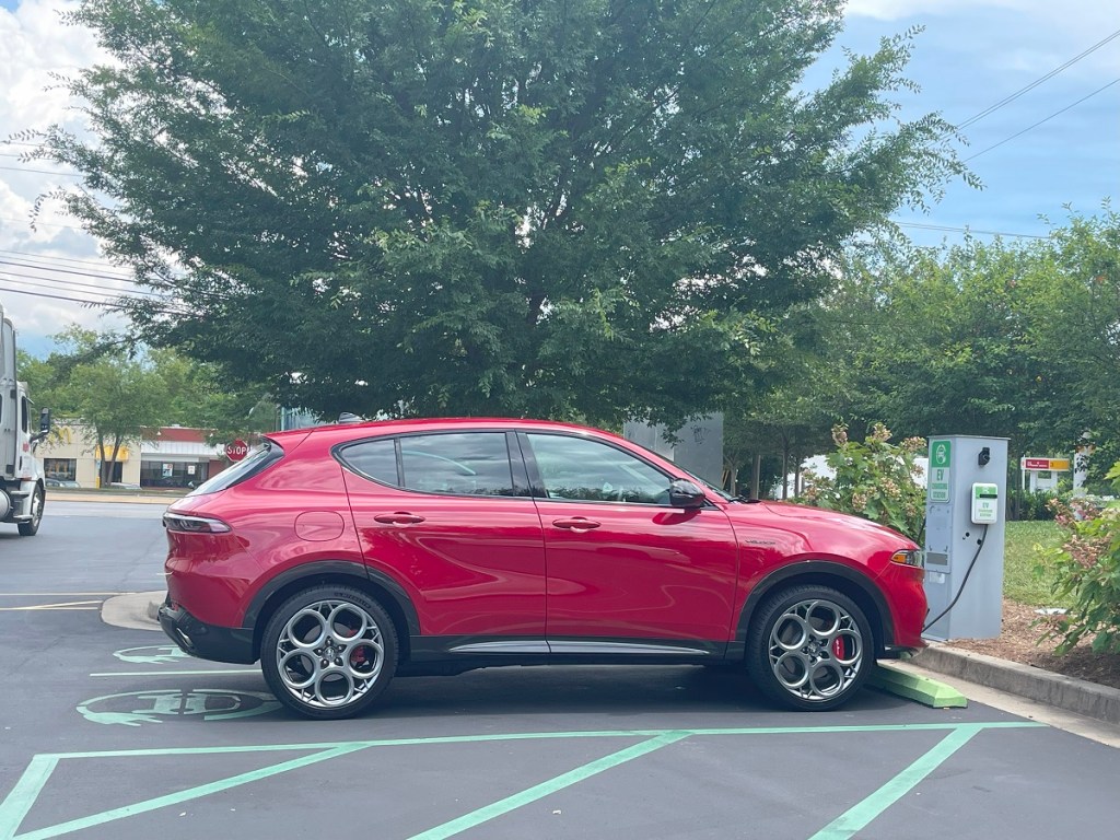 The 2024 Alfa Romeo Tonale at a charging station