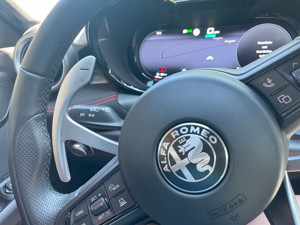The 2024 Alfa Romeo Tonale paddle shifters behind the steering wheel 