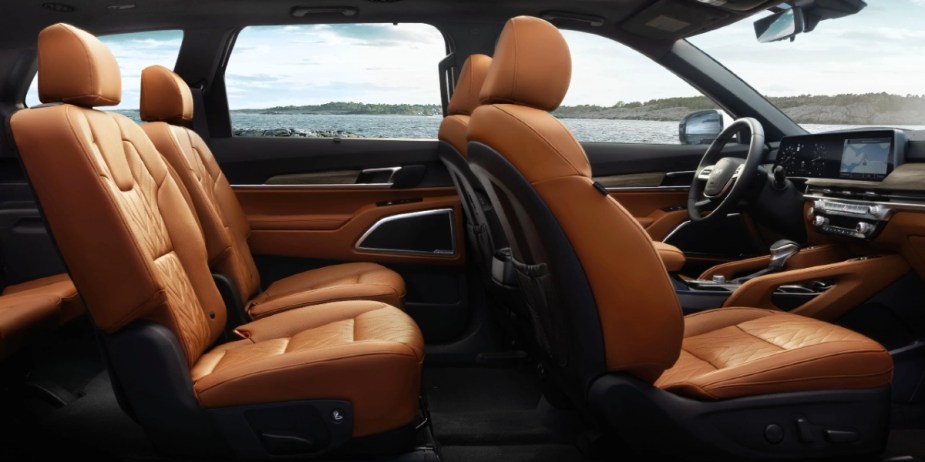 The interior features of a 2024 Kia Telluride three-row midsize SUV includes leather seats. 