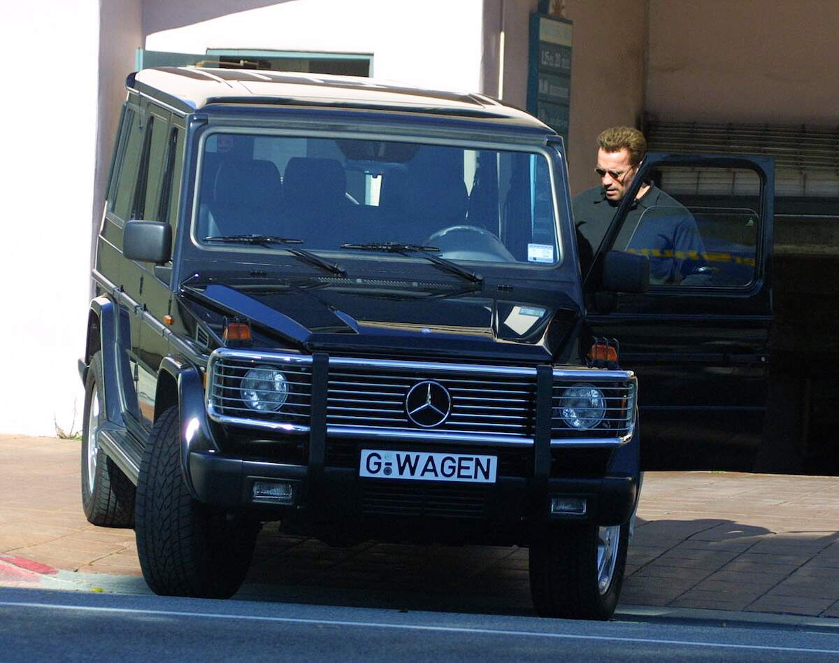 Arnold Schwarzenegger stands next to a Mercedes G-Wagen in Los Angeles in March 2001