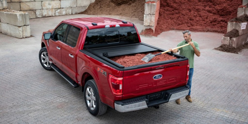 Red 2023 Ford F-150 at construction site