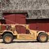 British SAS Dune Buggy parked in front of a barn in profile
