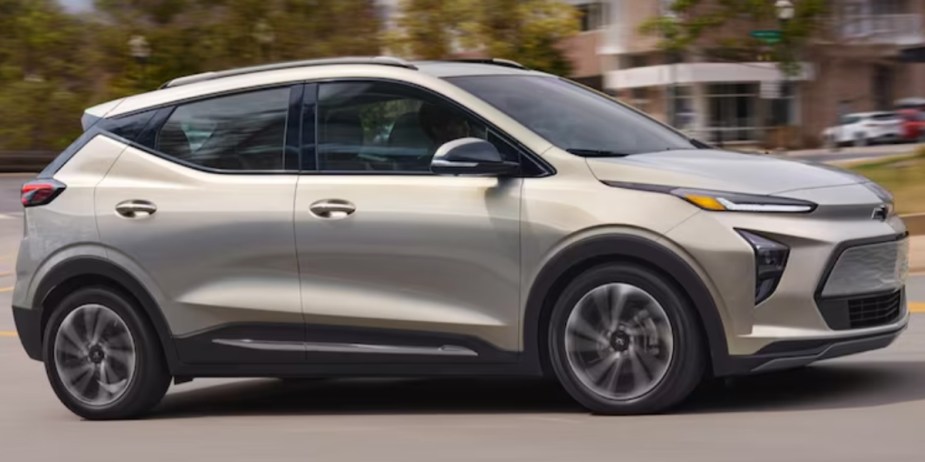 A gray 2023 Chevrolet Bolt EUV is driving on the road. 
