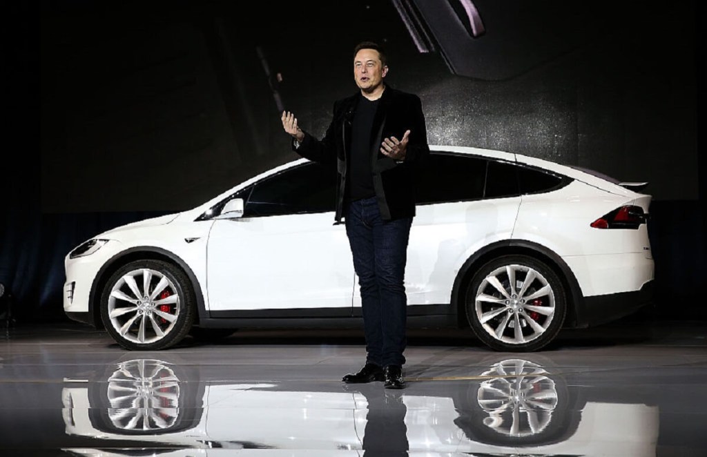 Elon Musk, one of the men who founded Tesla, stands in front of a Model X, the first SUV in the marque's history. 