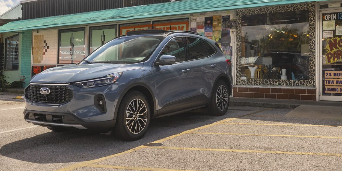 A blue 2023 Ford Escape small SUV is parked. 