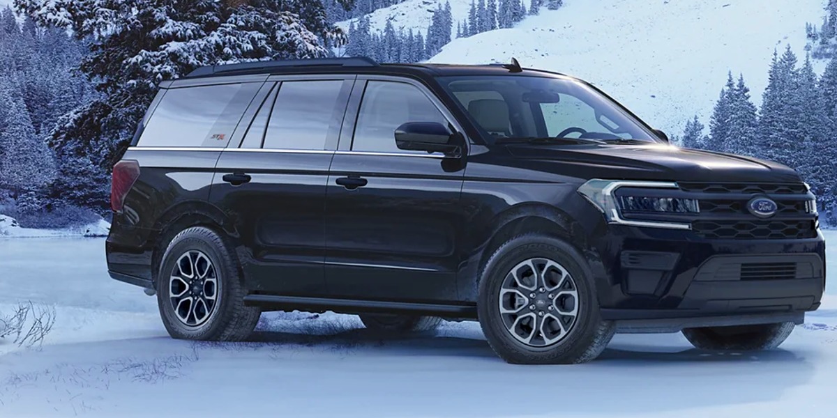 A black 2023 Ford Expedition full-size SUV is parked in the snow.