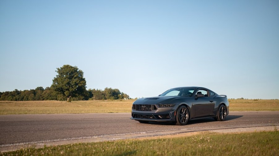 A Ford Mustang Dark Horse R without a racing livery sits on a track.