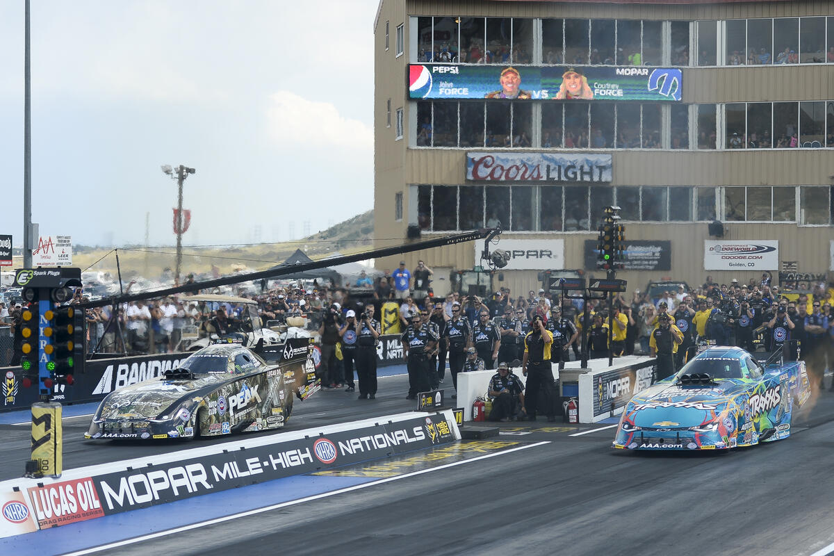 Funny Cars at Mile High Nationals at Bandimere Raceway with tower in background