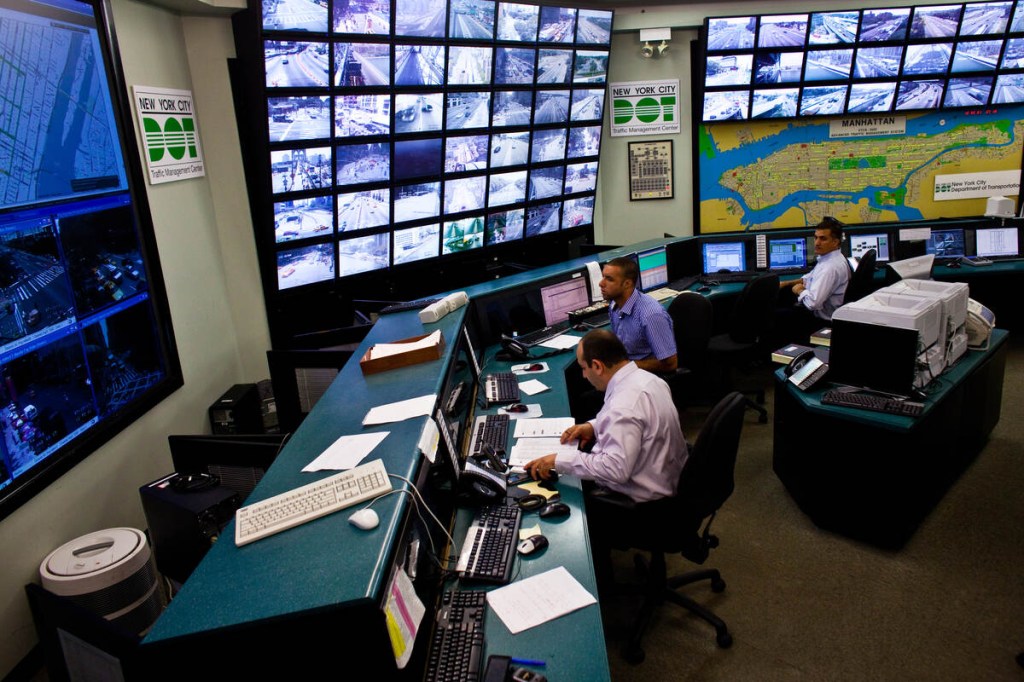 Traffic management center in New York with screens and workers