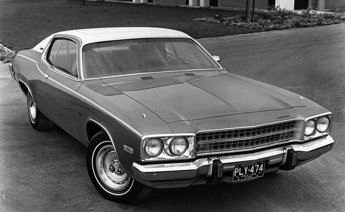 A 1974 Plymouth Satellite shows off its American muscle car fascia in black and white.
