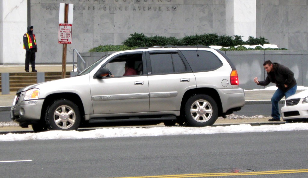A driver getting assistance with parallel parking 