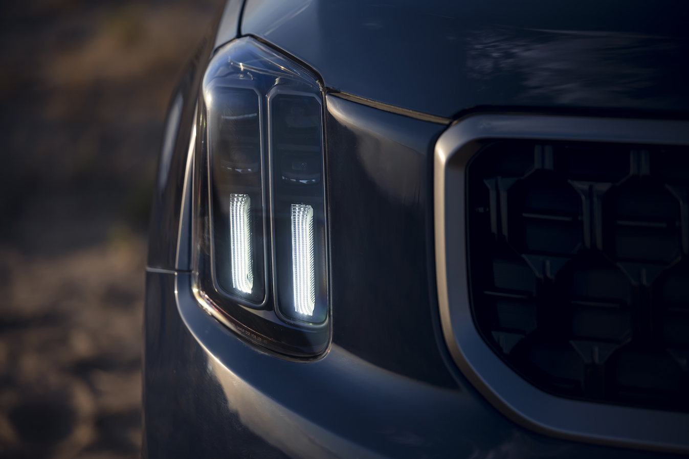 The front grille of the 2023 Kia Telluride, worth buying for sure, parked at sunset.