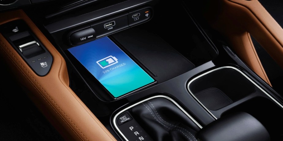 A phone is being charged wirelessly in the 2024 Kia Telluride.