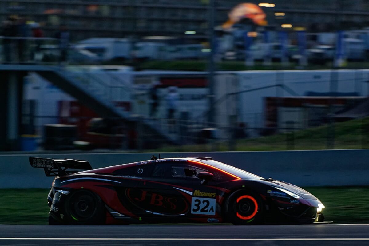 A racing Lamborghini shows off its glowing hot brakes. 