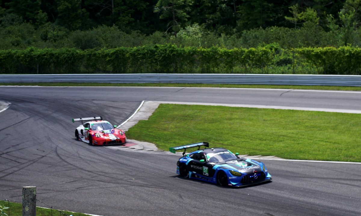 A Mercedes and Porsche GTD navigating the chicane at Lime Rock Park