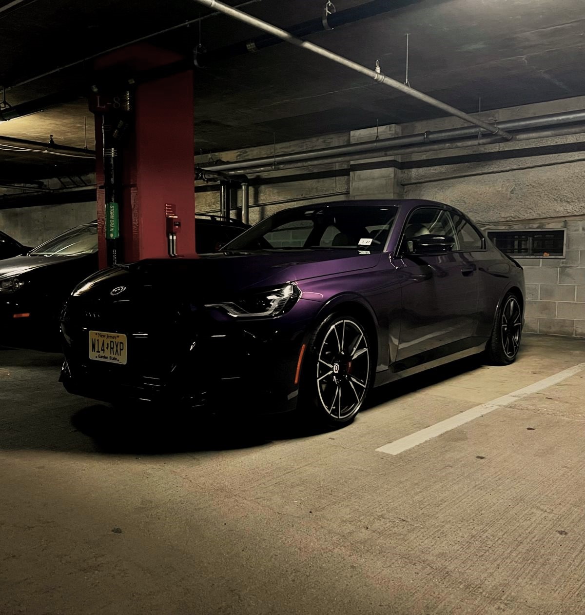 2023 BMW M240i parked in a parking garage