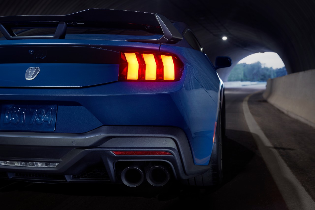 A Blue Ember Metallic 2024 Ford Mustang Dark Horse shows off its all-new taillights.
