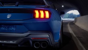 A Blue Ember Metallic 2024 Ford Mustang Dark Horse shows off its all-new taillights.