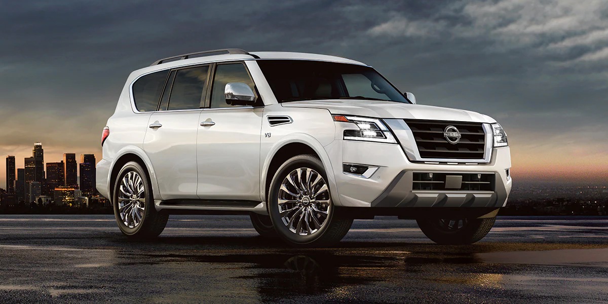 A white 2023 Nissan Armada full-size SUV is parked.