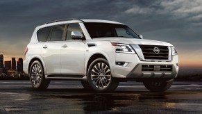 A white 2023 Nissan Armada full-size SUV is parked.
