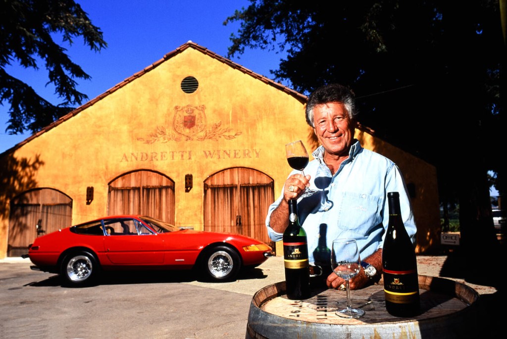Michael Andretti hawking wine with Ferrari prop 