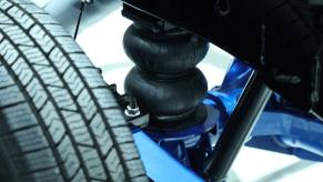 Closeup of an air suspension spring in a heavy-duty Ram for towing.