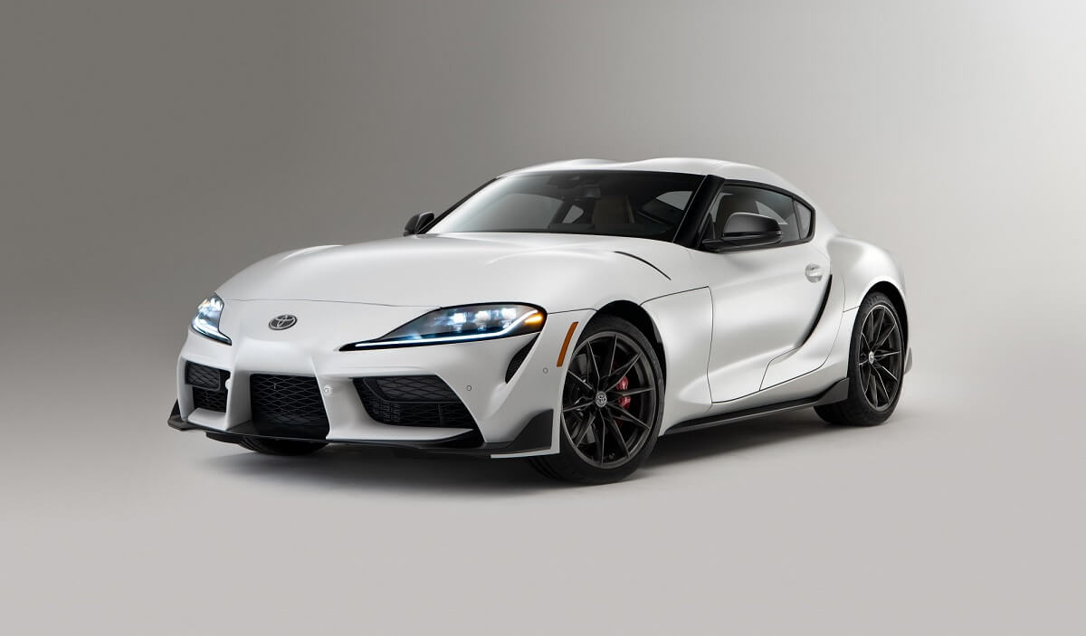 A white 2023 Toyota GR Supra 3.0 Mk5 shows off its front-end styling.