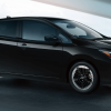 A 2024 Nissan Leaf SV Plus all-electric hatchback model in Super Black