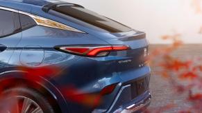 A rear shot of a 2024 Buick Envista Avenir compact SUV model featuring its trunk end model badging