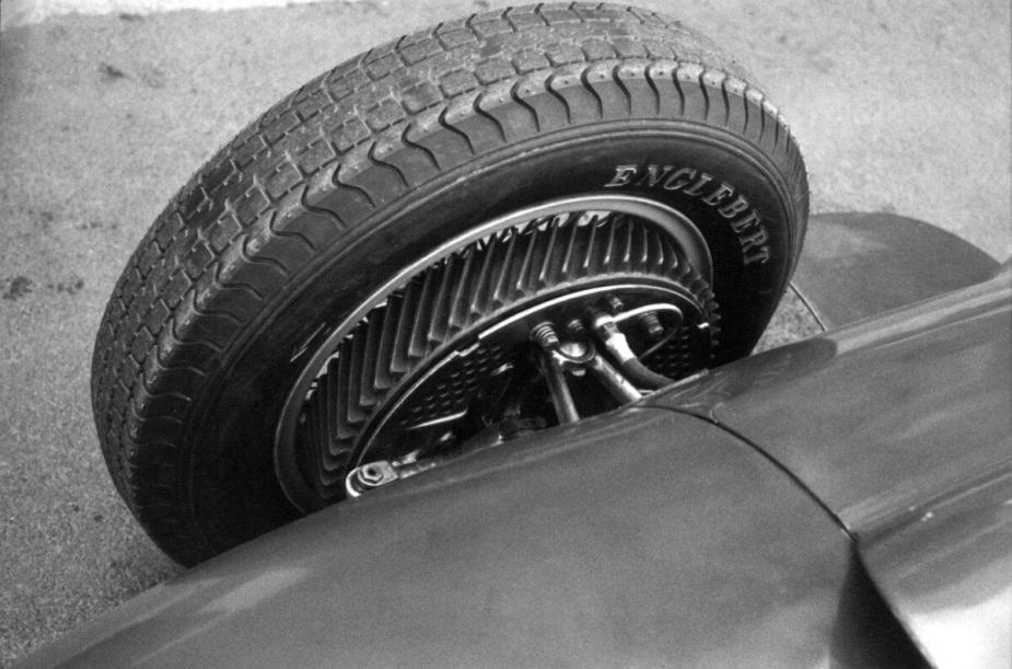 A black and white photo of a front drum brake on a Ferrari 246 F1