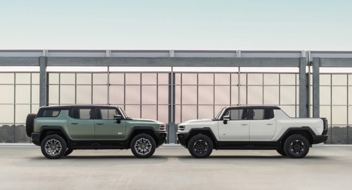 A 2023 GMC Hummer EV SUV and truck sit face to face while Hummer EV production is at a crawl