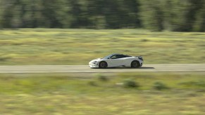 A White McLaren 750S going over 200 miles per hour on Highway 75 in Sun Valley Idaho during the Sun Valley Tour de Force in 2023