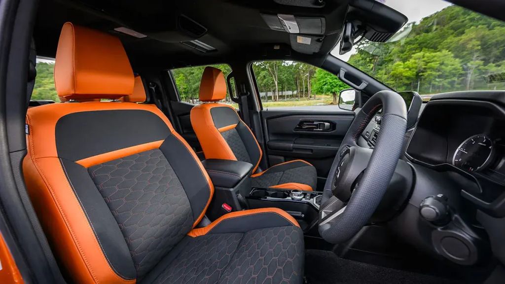 2024 Mitsubishi Triton pickup truck black and orange interior