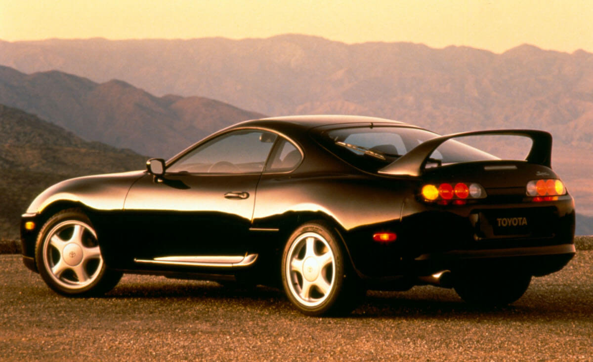 A rear angled view of a black Toyota Supra