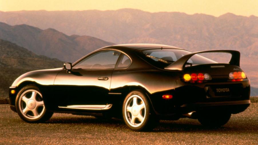 A rear angled view of a black Toyota Supra