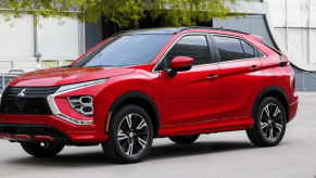 A 2024 Mitsubishi Eclipse Cross compact crossover SUV model in the Red Diamond paint color option
