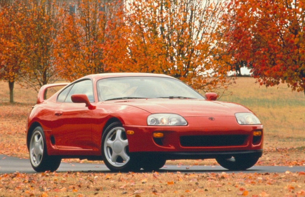Front right corner view of a red 1998 Toyota Supra