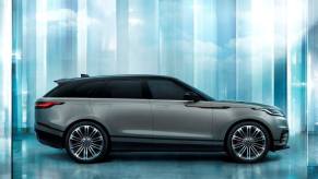 A side profile promotional shot of a 2024 Land Rover Range Rover Velar compact luxury crossover SUV model